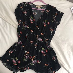 Black romper with small floral print
